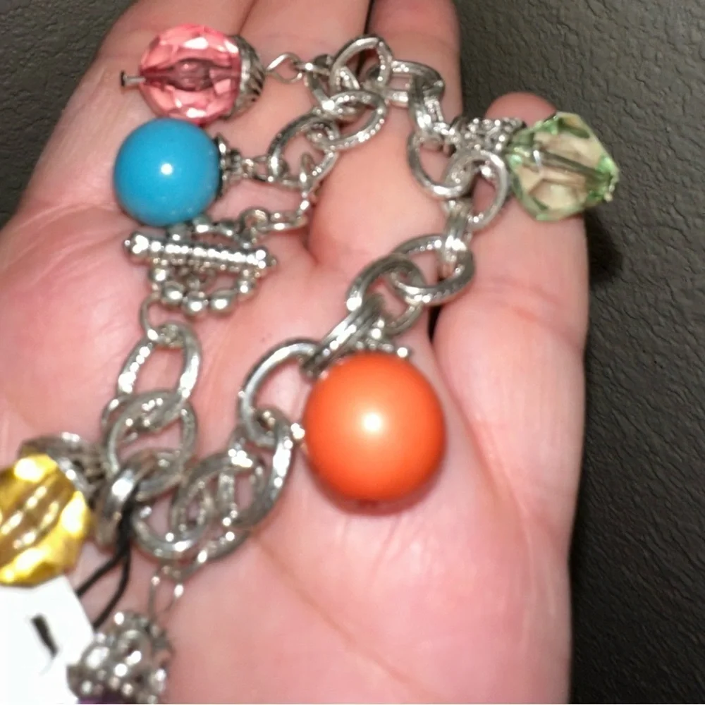 Silver charm bracelet beaded with toggle closure